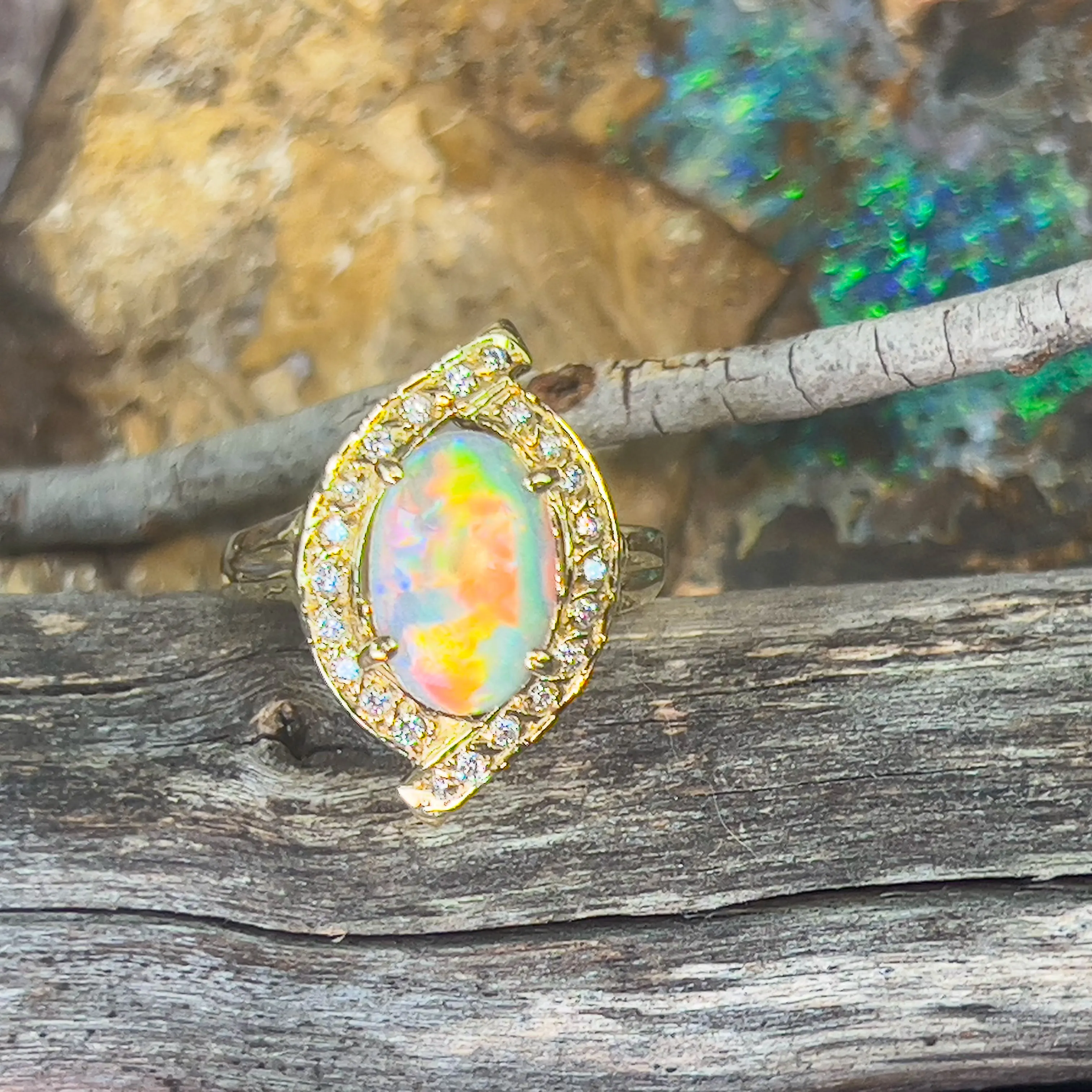 18kt Yellow Gold cluser cross over Black Opal 3.14ct Red flash diamond ring