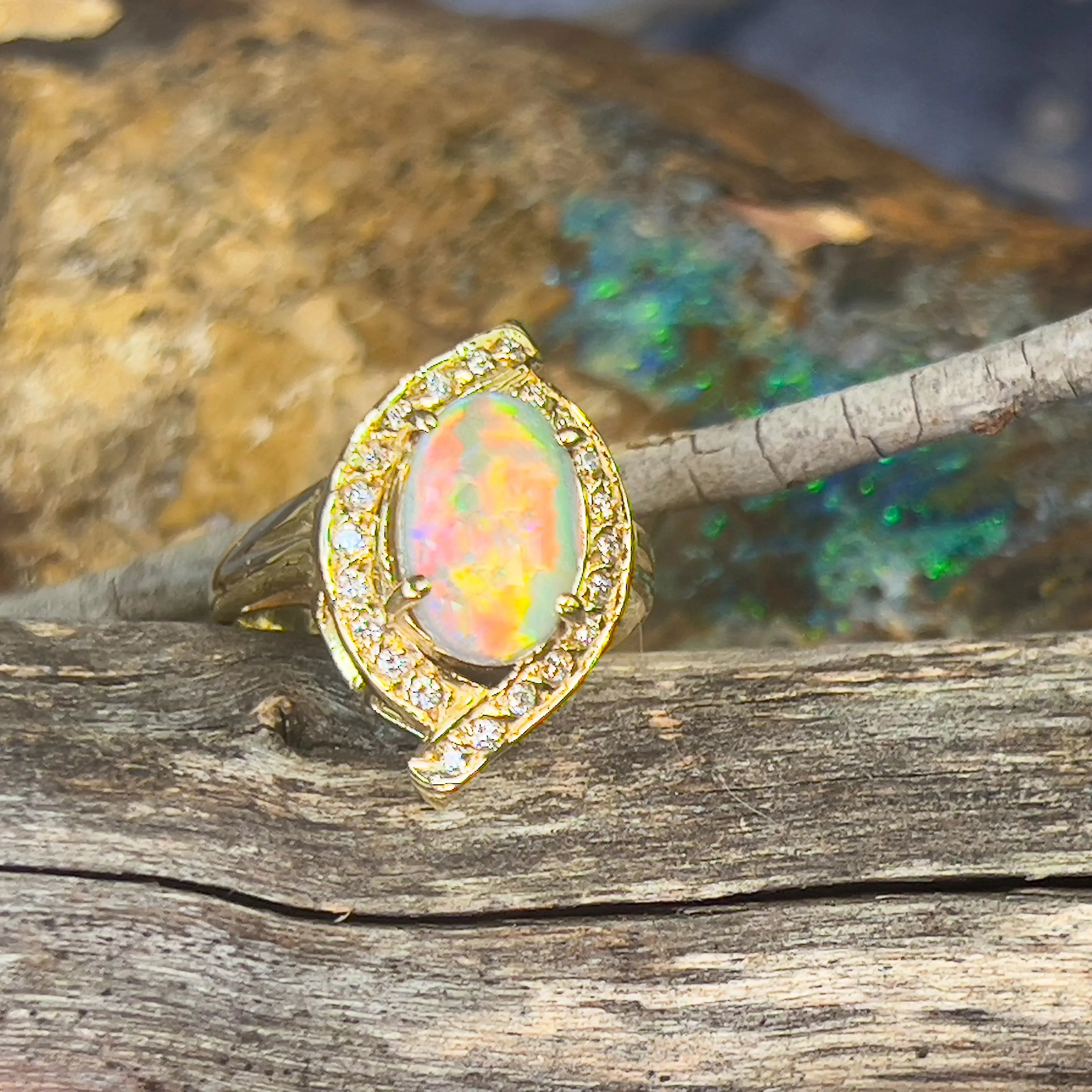 18kt Yellow Gold cluser cross over Black Opal 3.14ct Red flash diamond ring