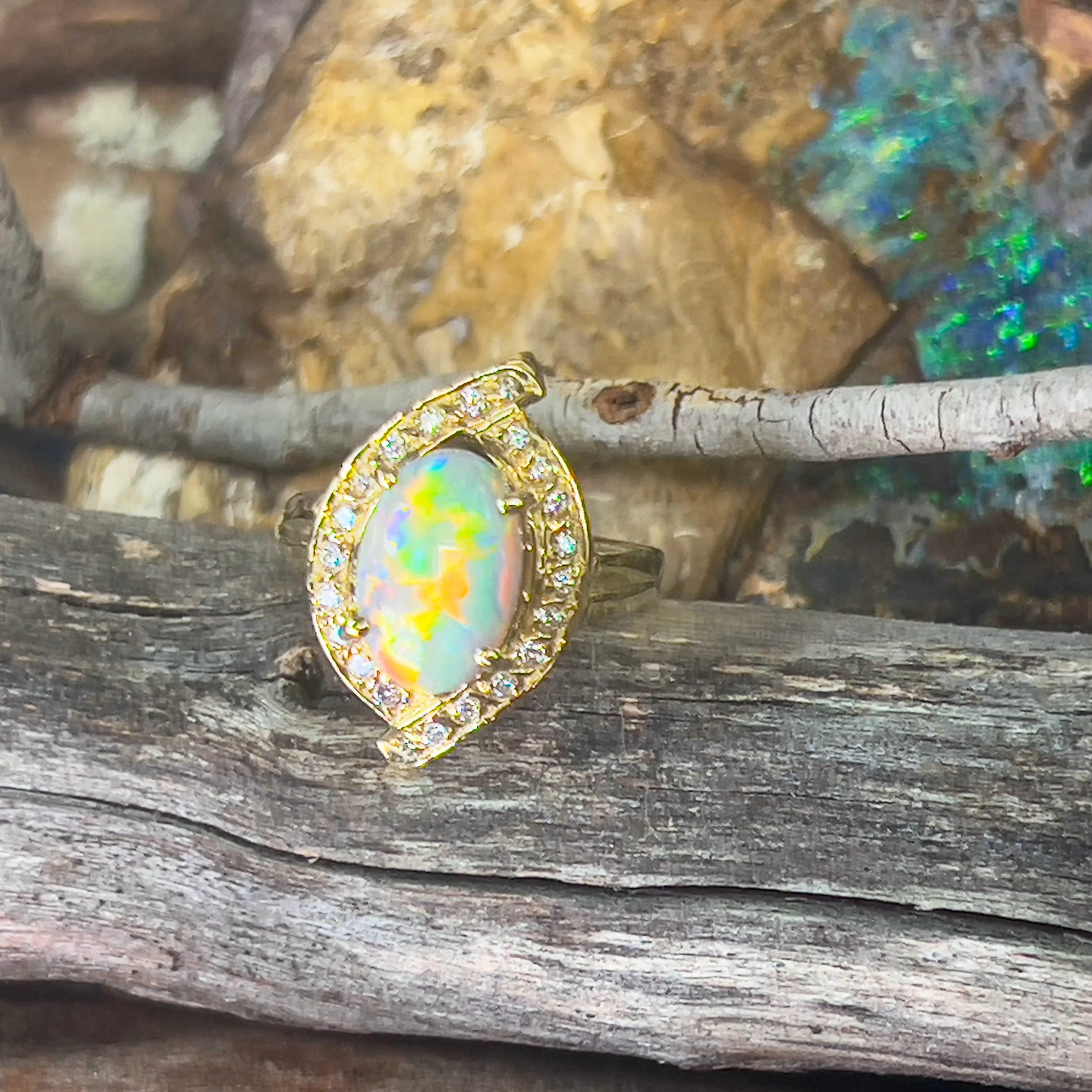 18kt Yellow Gold cluser cross over Black Opal 3.14ct Red flash diamond ring