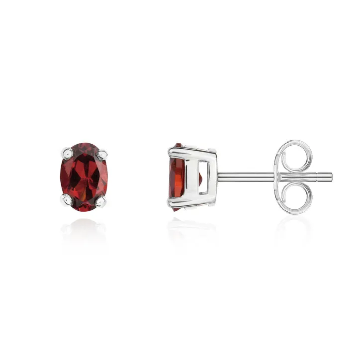 9ct white gold 6x4mm oval garnet claw set stud earrings