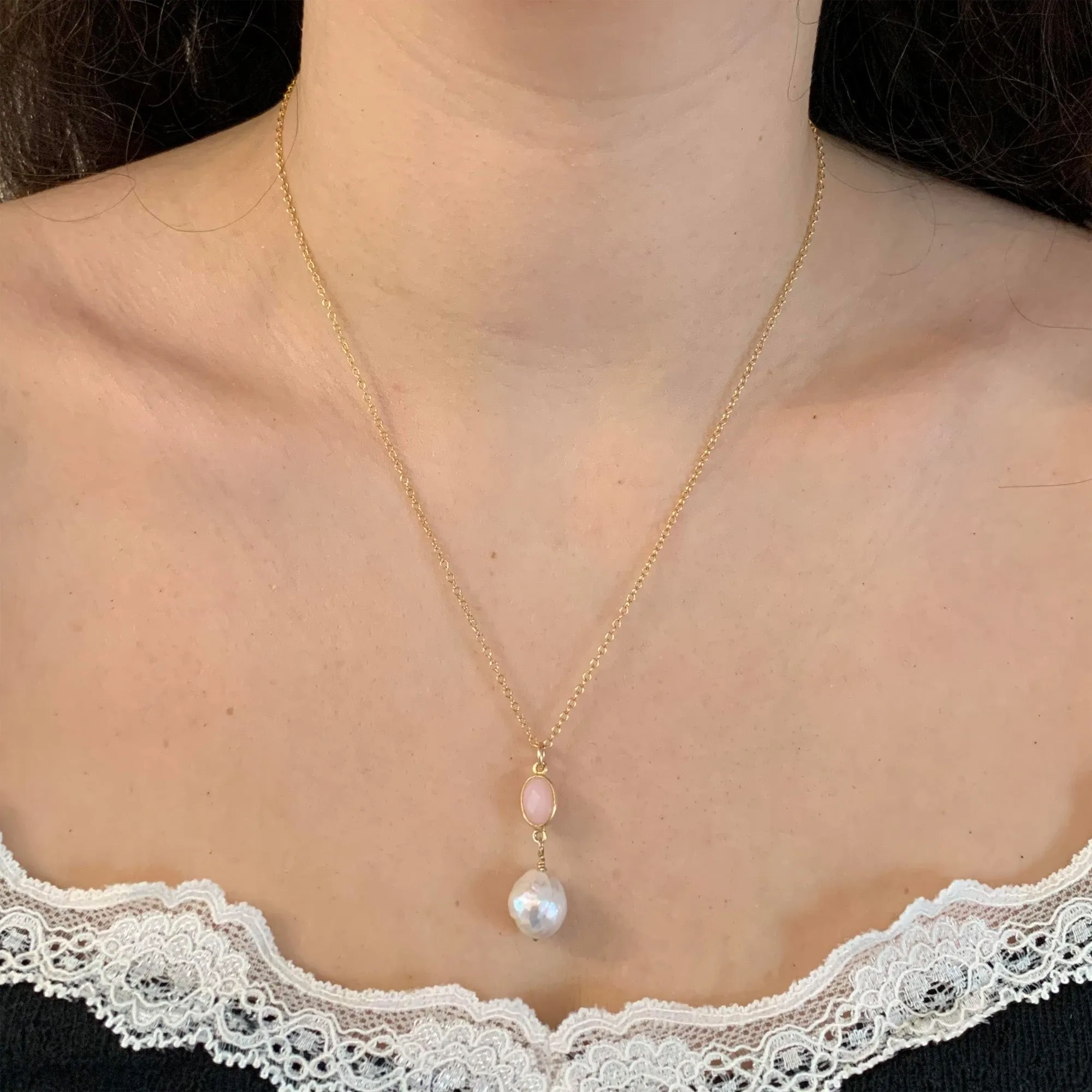 Gemstone necklace with pink opal crystal and large pearl pendant on gold cable chain