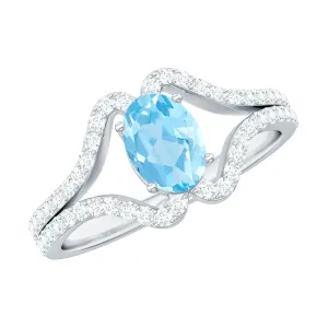 Oval Aquamarine Split Shank Engagement Ring with Diamond